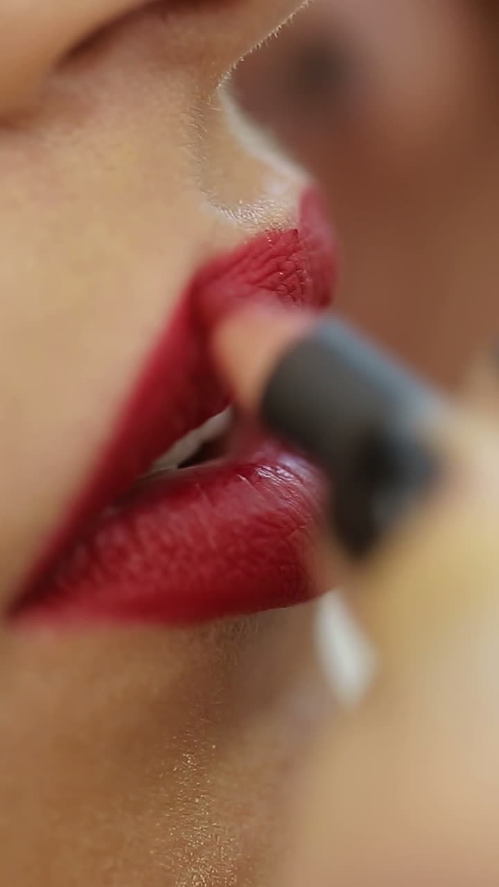 Permanent Makeup On Lips. Cosmetologist applying permanent make-up on lips