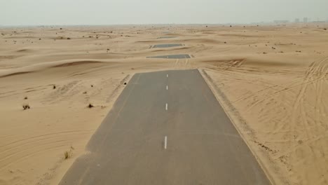desert road through dunes