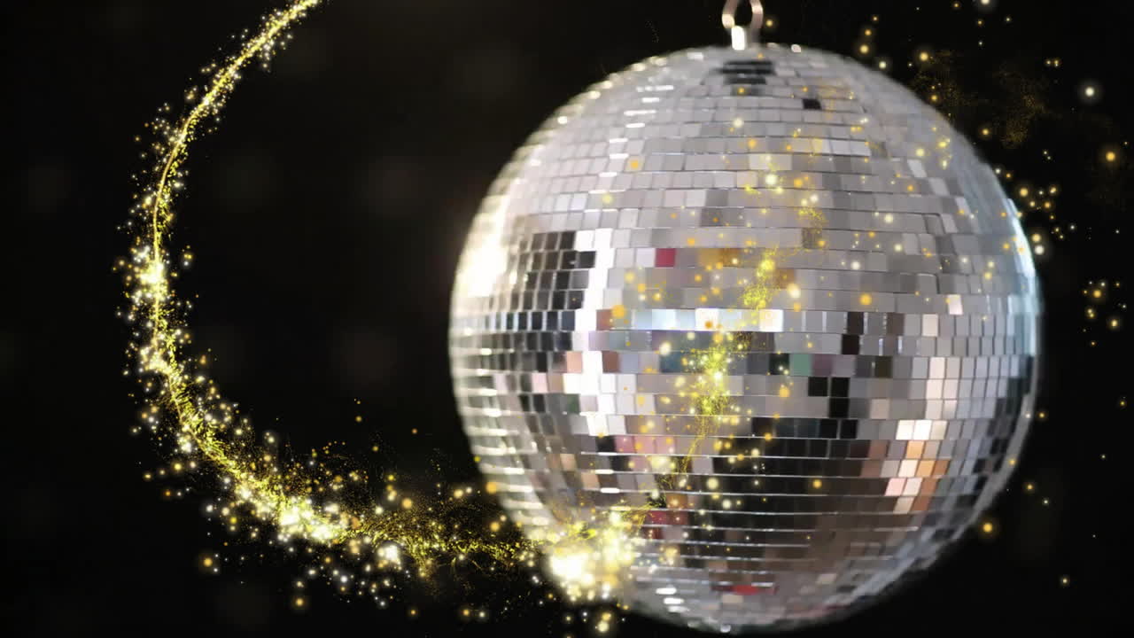 Mirrored disco ball reflecting bright light and swirling golden sparkles in dark studio 3D render