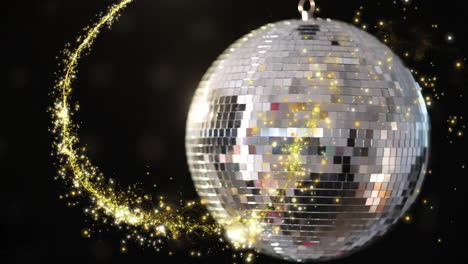 mirrored disco ball reflecting bright light and swirling golden sparkles in dark studio 3d render
