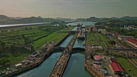 panama city aerial v40 low level fly around miraflores locks capturing hydraulic structure facility with cargo ship transiting and waiting for sluice gate to open - shot with mavic 3 cine - march 2022