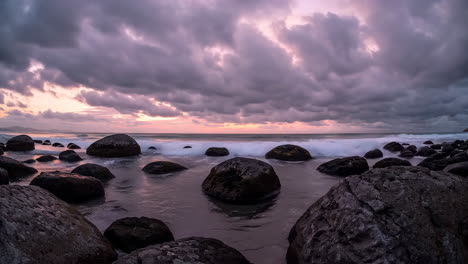 dramatic sunset or sunrise over a rocky beach