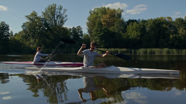Two people kayaking on a river