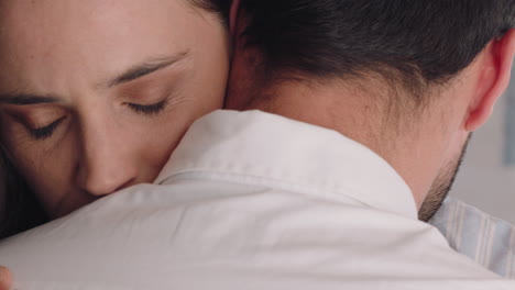 unhappy woman hugging boyfriend young couple having relationship trouble embracing emotional issues sharing bad news