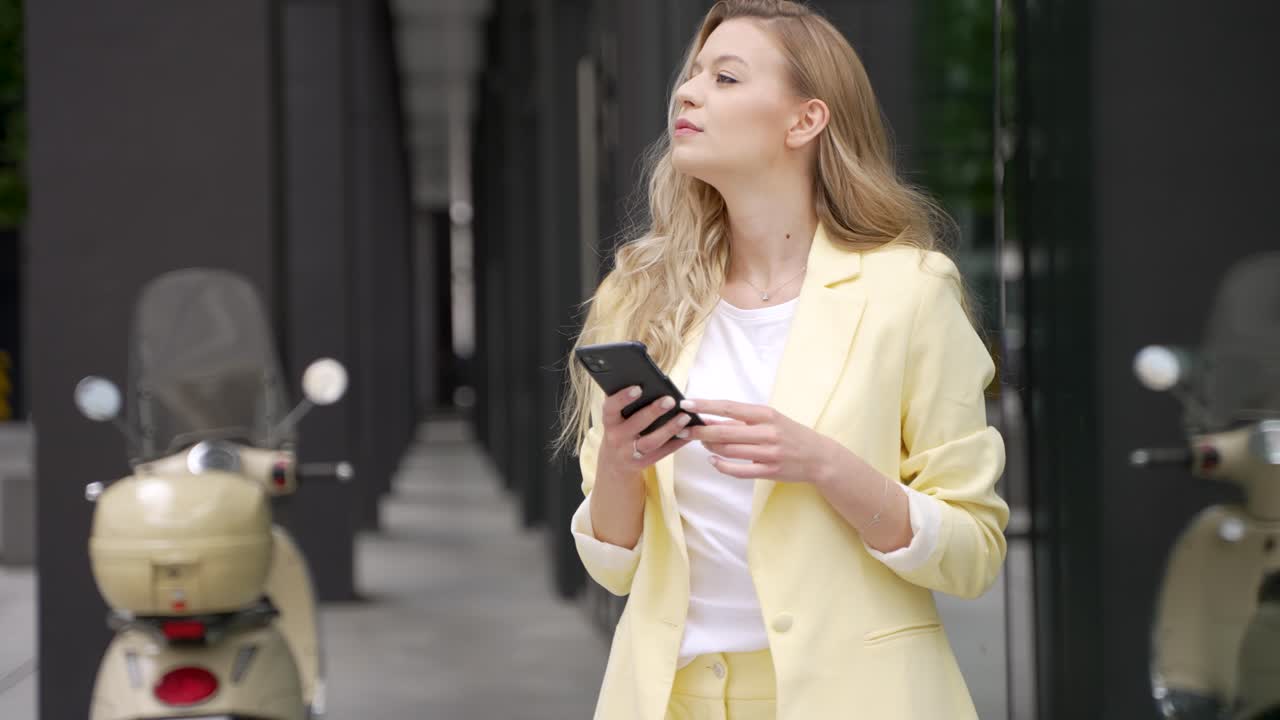 Woman using smartphone in city