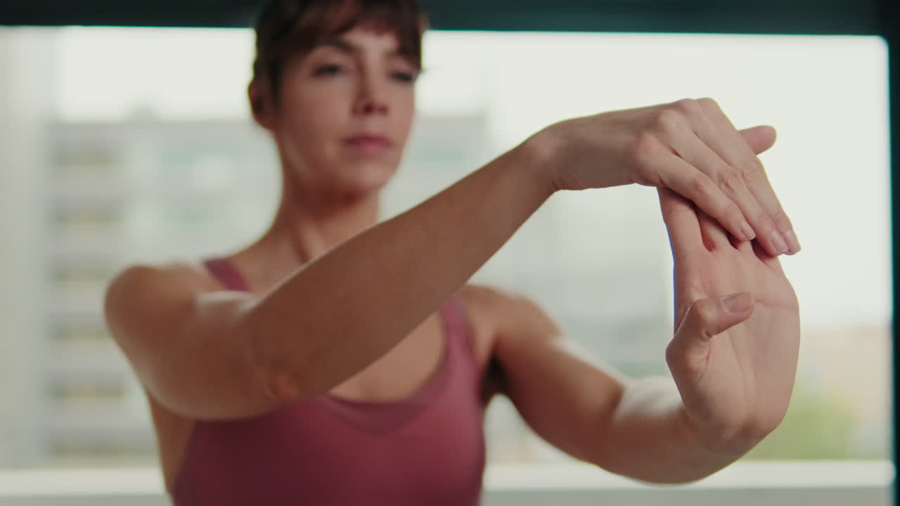 Woman Stretching Her Hands at Home