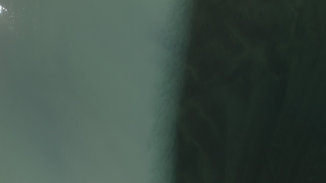 Milky colours of glacier meltwater meets fresh water river in Lom