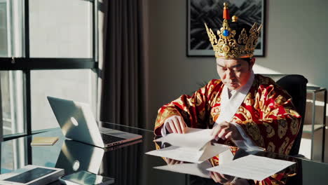 king signing documents in a modern office