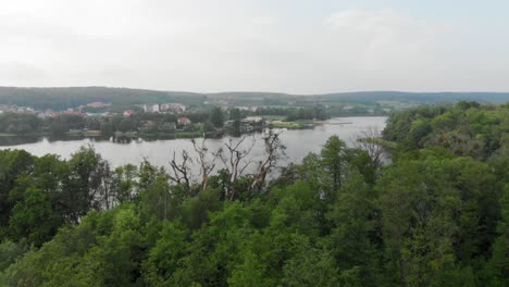 Truck-shot-of-a-lake-and-trees-in-Kolbudy-