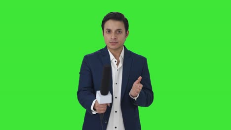 Indian-reporter-asking-questions-to-someone-Green-screen