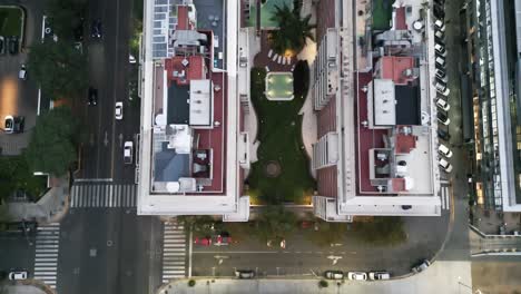 Aerial-Drone-Fly-Above-High-Apartments-of-Buenos-Aires-City-with-Swimming-Pool,-Roof-View-amongst-Streets-with-Car-Traffic-and-Trees