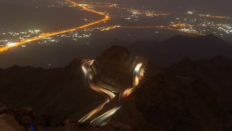 traffic light trails wrapped around mountain on the zig zag road in al hada, taif region of saudi arabia