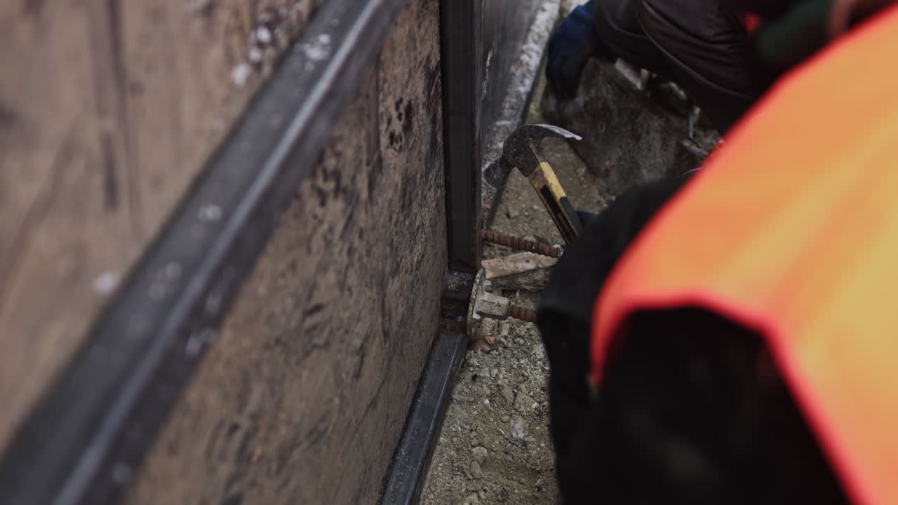 Construction worker installing framing