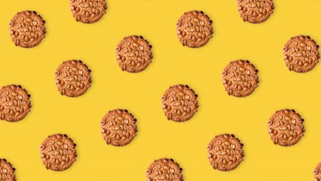 seamless looping pattern animation of peanut cookies on a yellow background