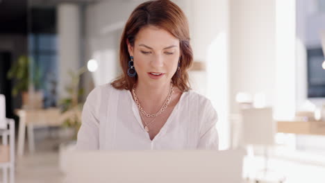 Design-woman,-typing-and-laptop-in-workshop