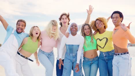 multi-ethnic group of friends embracing and smiling at camera