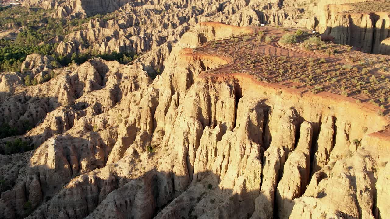 Geology. erosion effect. Ravine and gullies at sunset, aerial view. Badlands caused by severe erosion. Climate change and desertification. Viewpoint of the end of the world. Purullena. Granada. Spain