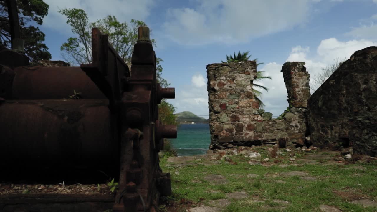 Historic abandoned factory with a giant water wheel in Tobago.