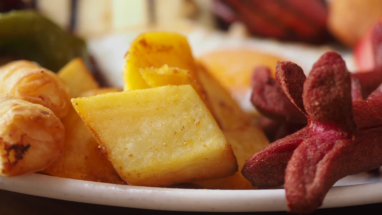 Breakfast with fried potatoes, sausage, egg, and pepper