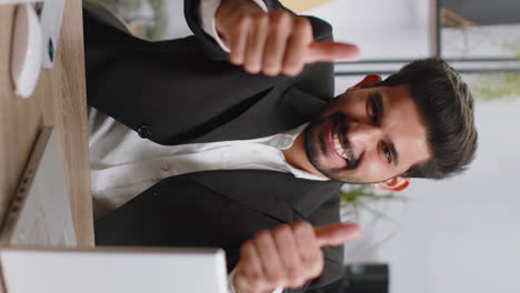 Happy-business-man-looking-approvingly-at-camera-showing-thumbs-up,-like-positive-sign,-good-news