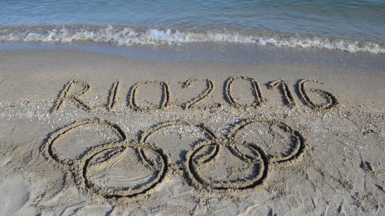 Rio 2016 an inscription on sand, the beach. Symbol Olympic game on sand, the beach
