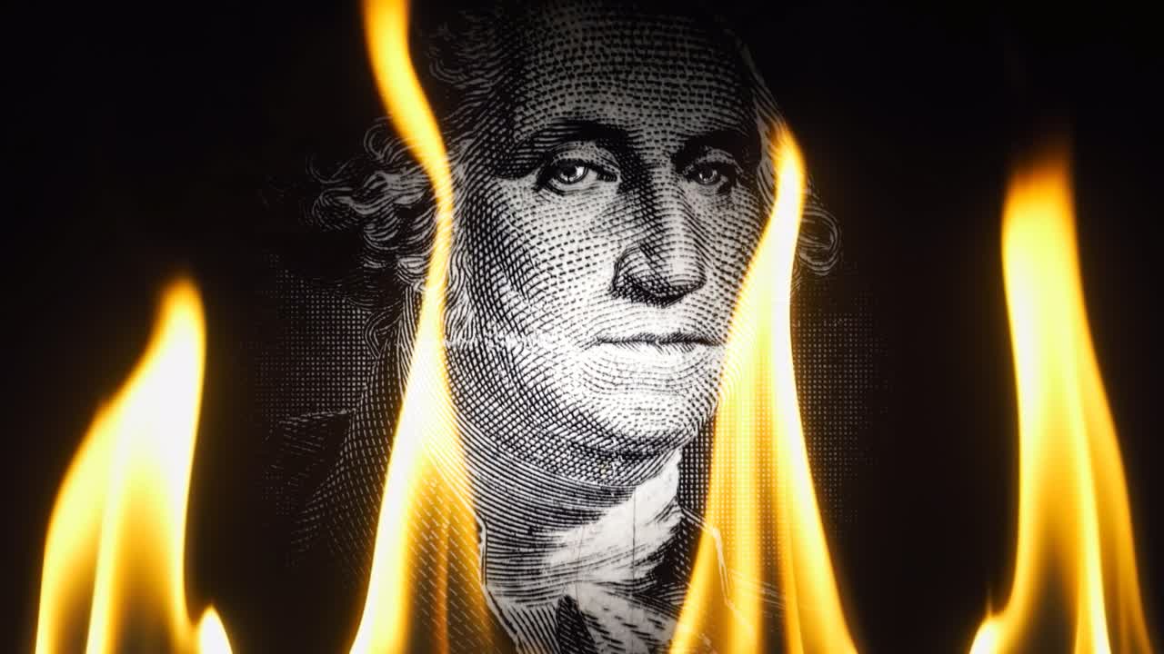 Portrait of George Washington on a black background in flames. Conceptual 4k slow motion video. The idea of ​​a financial crisis.