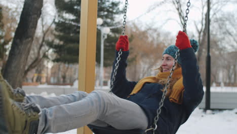 man in wheelchair enjoying winter day in park