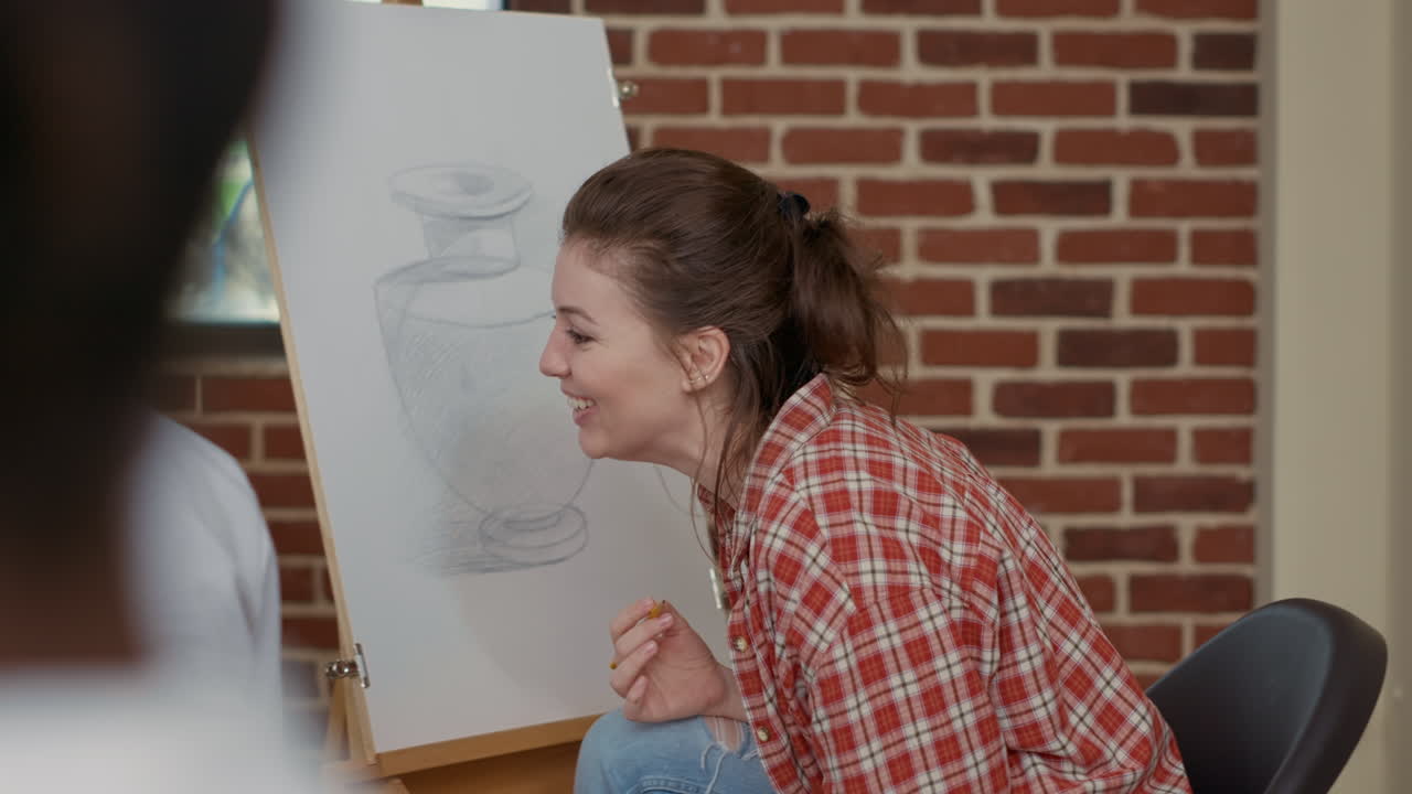Young woman laughing and having fun at art lesson practice