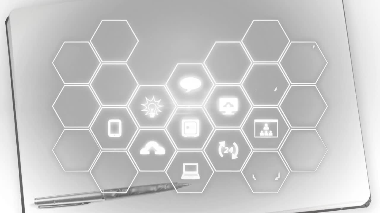 Animation of network of digital icons over pen and notebook in background
