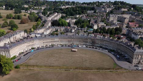 aerial, wide view of royal crescent in bath, uk on a summers day, central framing, ascending