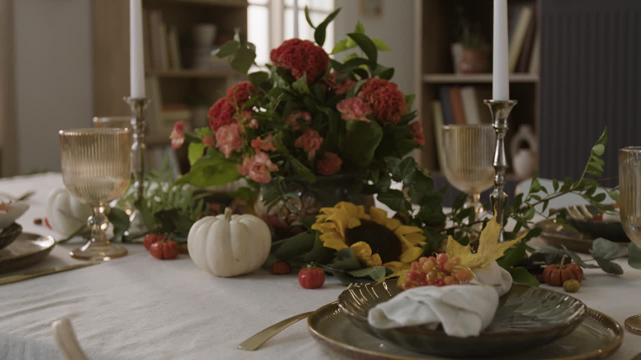 Festive Table Setting with Flowers and Pumpkins