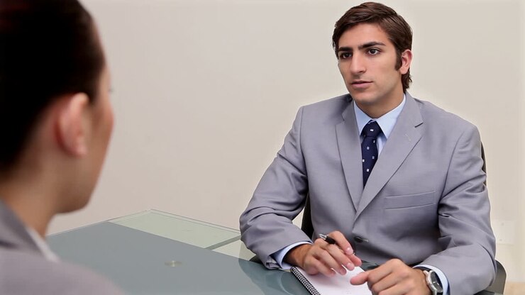 Man speaking with a businesswoman