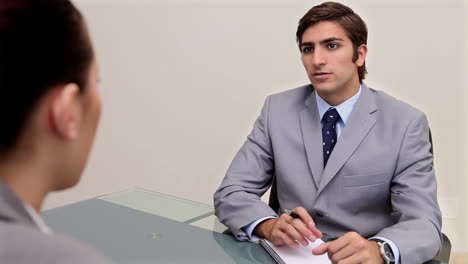 man speaking with a businesswoman