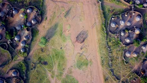 Top Down View Of Karamojong Dancing In Between Two Villages In Uganda - Drone Shot