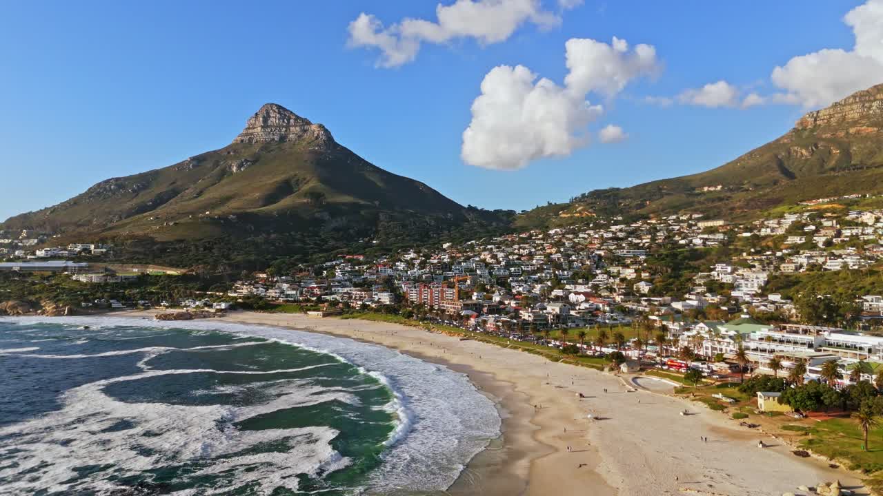 Imagine a drone gliding smoothly over the pristine shores of Camps Bay Beach.