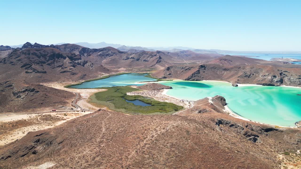 Breathtaking aerial view of blue lagoons surrounded by mountains in Tecolotito, Mexico