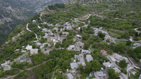 aerial view of kalarites village in tzoumerka mountains epirus greece, aerial dolly shot of stone made houses and traditional village