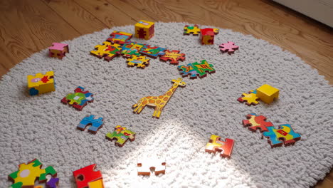 giraffe puzzle pieces on carpet