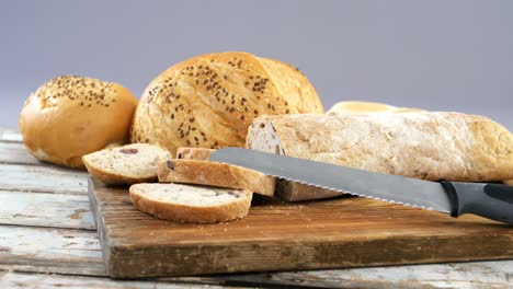 various bread loaves with knife