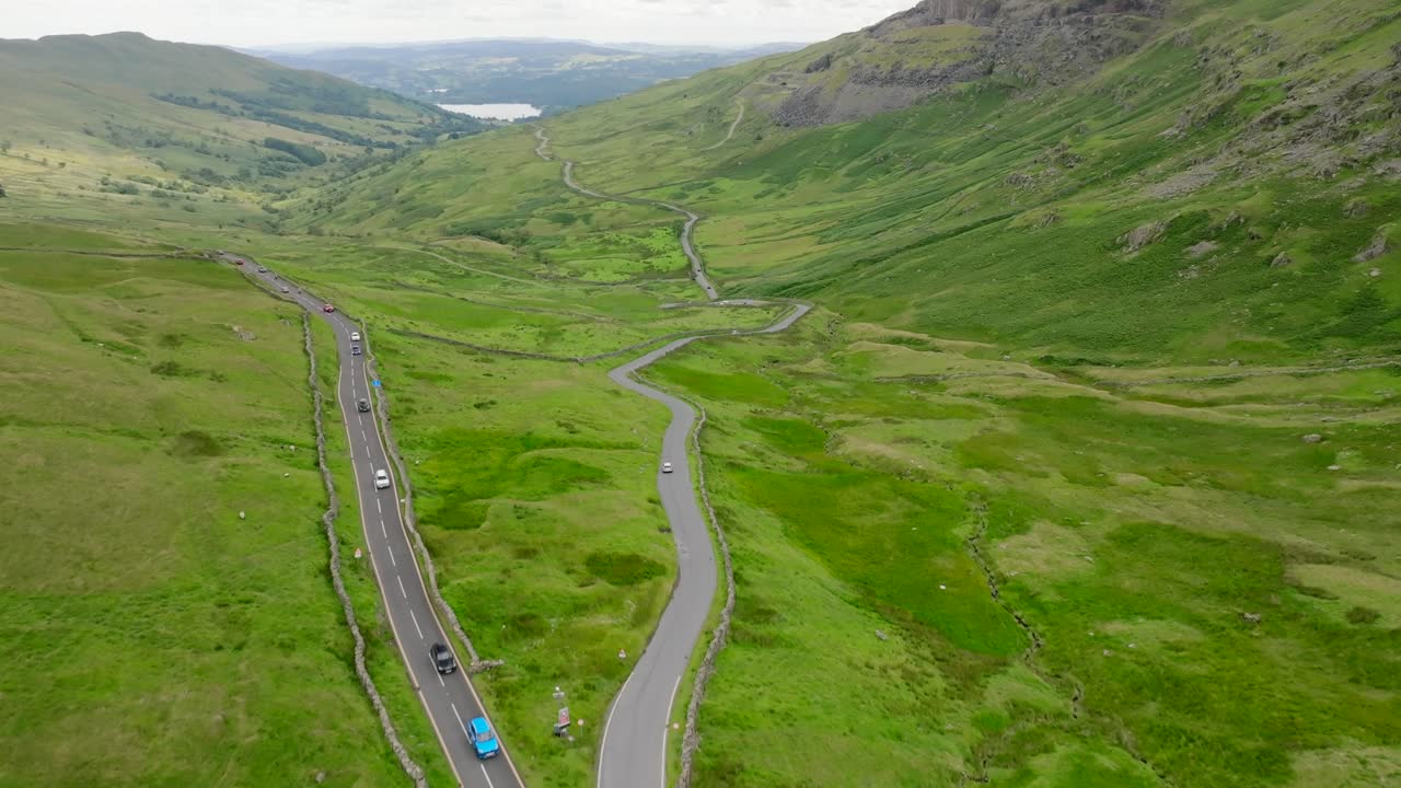 Flyover of The Kirkstone Pass Inn Under Redevelopment. With Lake Windermere In The Distance. Summer. Kirkstone Pass, Lake District, Cumbria, UK