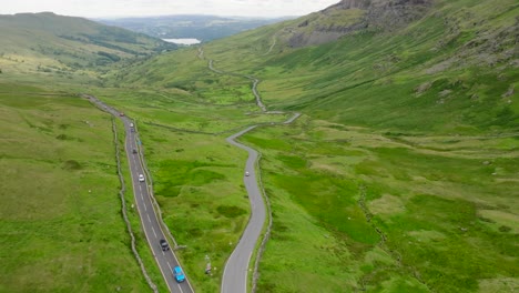 flyover of the kirkstone pass inn under redevelopment. with lake windermere in the distance. summer. kirkstone pass, lake district, cumbria, uk