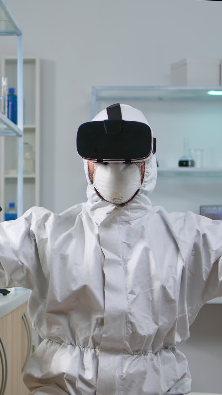 Vertical video: Scientist researcher in protection suit using VR