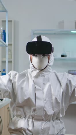 vertical video: scientist researcher in protection suit using vr