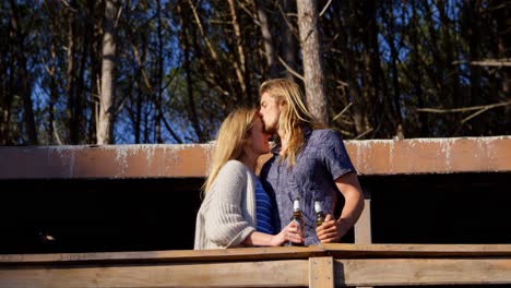 Man-kissing-woman-forehead-in-cabin-4k
