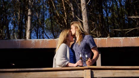 man kissing woman forehead in cabin 4k