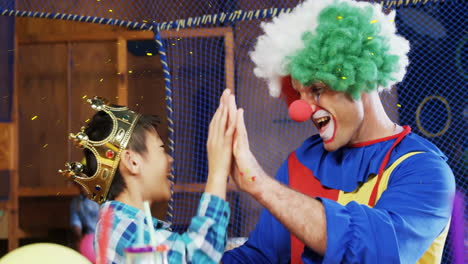 clown high-fiving child wearing crown, celebration animation