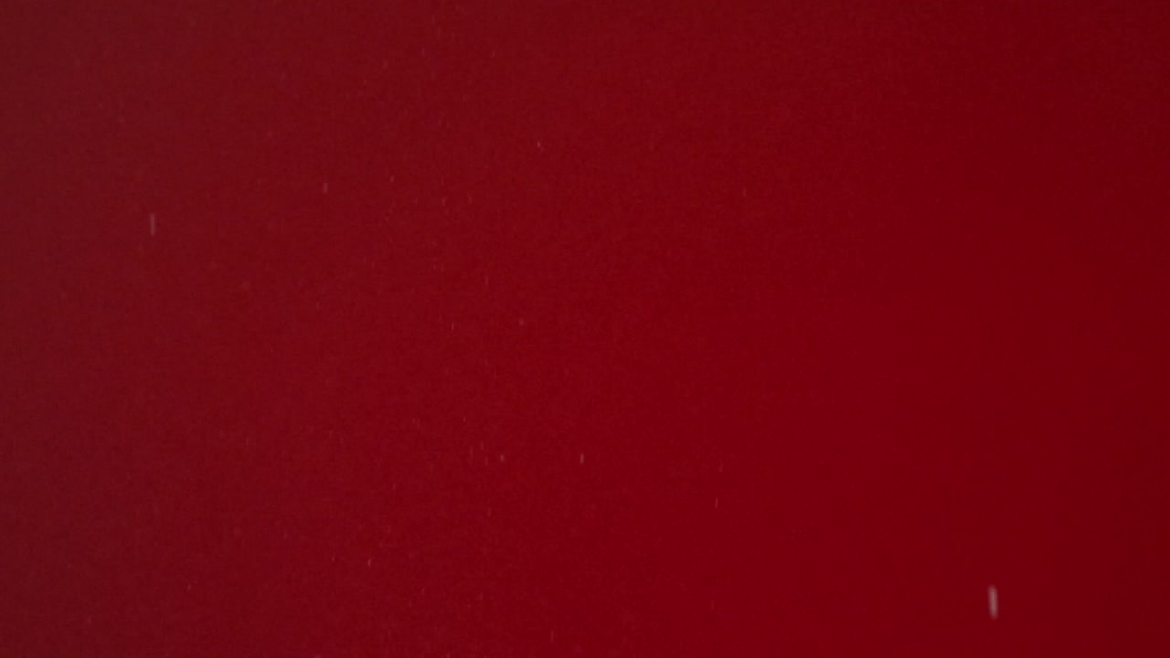 Sugar Cube Falling on Red Surface