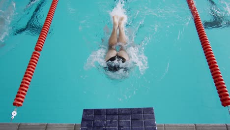 swimmers swimming into the pool