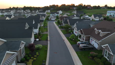 Aerial-dolly-forward-and-rising-shot-of-American-neighborhood