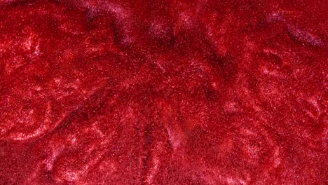 primer plano de una tela de terciopelo rojo con chispas